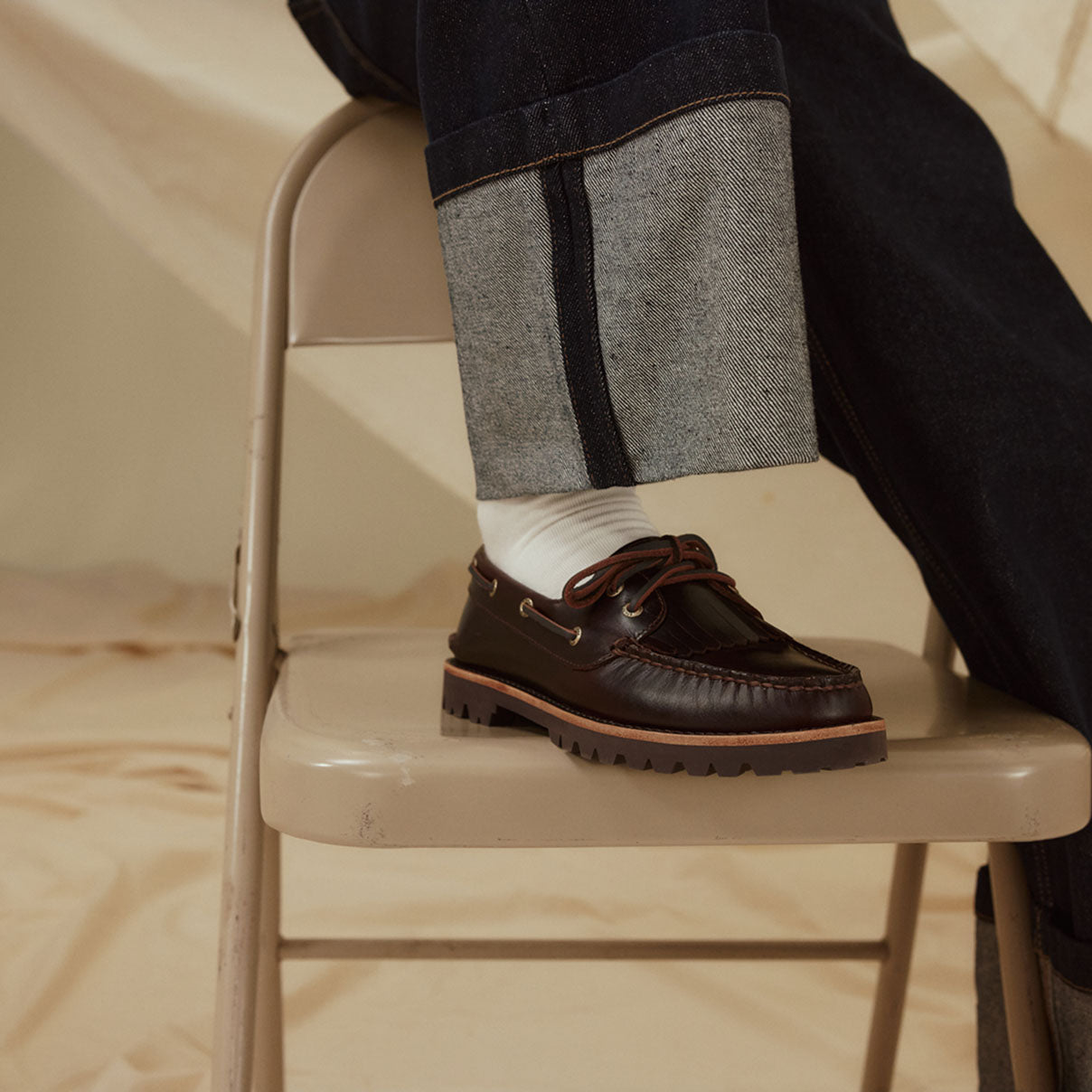 A woman's boat shoe on a chair